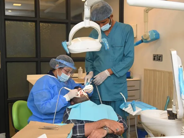 Treatment underway with a dentist and nurse